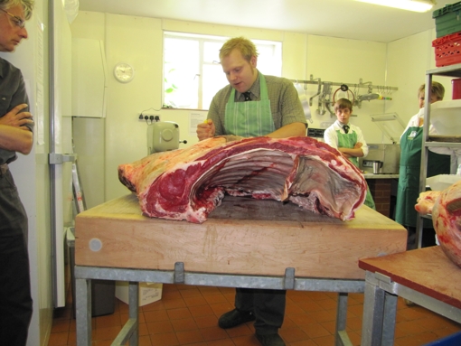 Jim begins breaking down a side of Longhorn beef