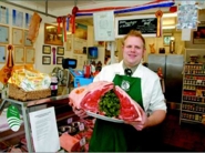 Jim Sutcliffe in the shop with Longhorn ribs of beef